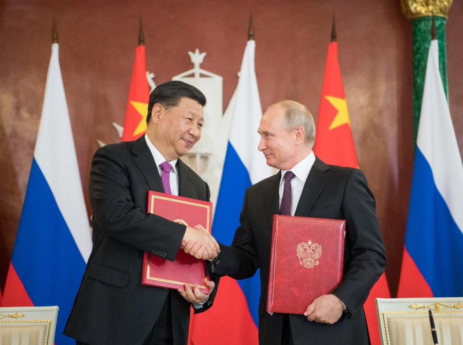 MOSCOW, June 5, 2019 (Xinhua) -- Chinese President Xi Jinping (L) and his Russian counterpart Vladimir Putin sign the statements on elevating bilateral ties to the comprehensive strategic partnership of coordination for a new era and on strengthening contemporary global strategic stability, and witness the signing of a number of cooperation documents, after their talks in Moscow, Russia, June 5, 2019. Xi Jinping held talks with Vladimir Putin at the Kremlin in Moscow on Wednesday. (Xinhua/Li Xueren/IANS) by . 