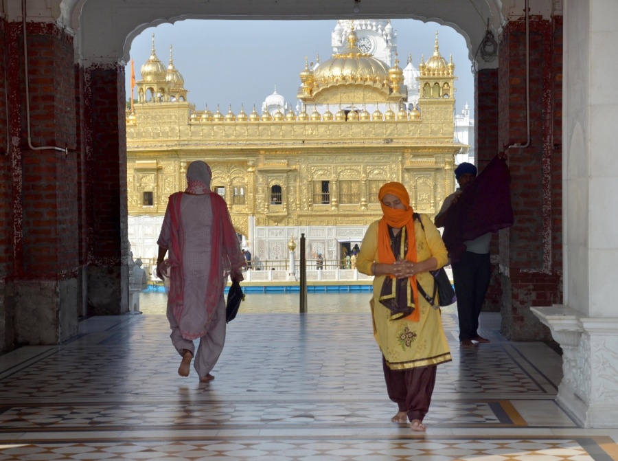 Amritsar: Devotees at the Golden Temple in Amritsar that reopened for devotees on June 8, 2020. Restaurants, shopping malls, hotels and religious places on Monday threw their doors open to the public over nearly two and a half months after the COVID-19 induced nationwide lockdown was imposed across the country. As a part of the 'Unlock 1', the Centre has asked religious places, restaurants, malls to thoroughly cleanse the area and adhere to social distancing norms and other protocols. (Photo: IANS) by . 