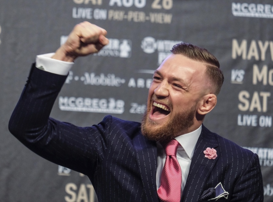 LOS ANGELES, July 12, 2017 (Xinhua) -- UFC fighter Conor McGregor reacts during a news conference at the Staples Center in Los Angeles, the United States on July 11, 2017. Conor McGregor will fight with boxer Floyd Mayweather Jr. in a boxing match in Las Vegas on August 26. (Xinhua/Zhao Hanrong/IANS) by . 