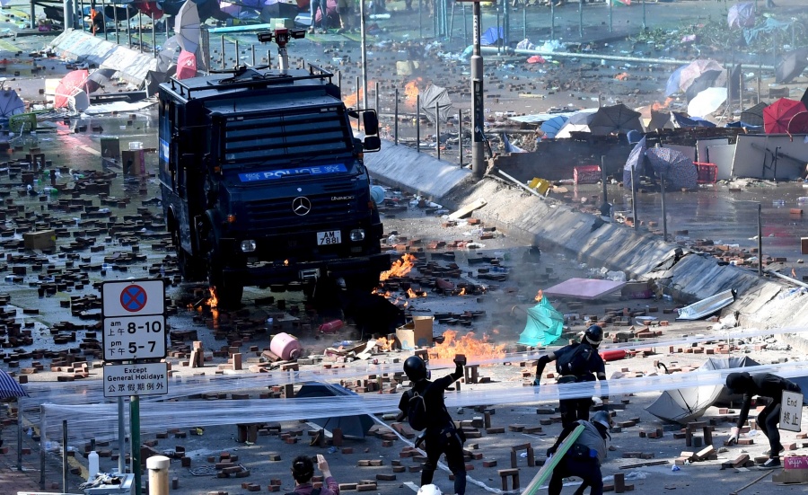 HONG KONG, Nov. 19, 2019 (Xinhua) -- Rioters throw bricks to a police vehicle outside the Hong Kong Polytechnic University in south China's Hong Kong, Nov. 17, 2019. Several former world leaders voiced their firm support for the Chinese central government's stance on the situation of the Hong Kong Special Administrative Region (HKSAR), saying they believed that China has the political wisdom to resolve social disturbance, end violence and restore order in Hong Kong. (Xinhua/IANS) by .