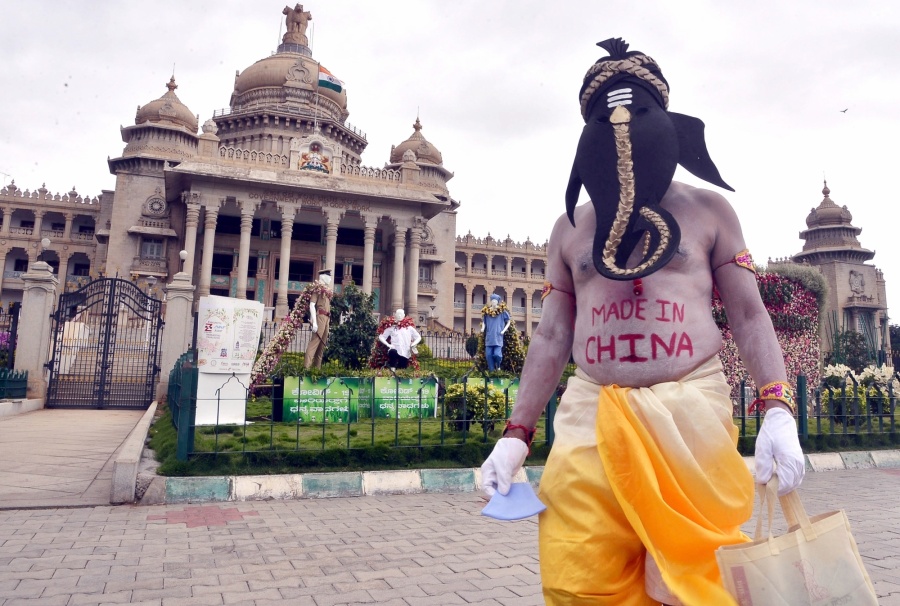 Bengaluru: Artiste Paramesh Jolad dressed up as Lord Ganesha spreads awareness urging people to boycott Chinese products and use only domestic products, in front of Vidhana Soudha in Bengaluru on June 13, 2020. (Photo: IANS) by .