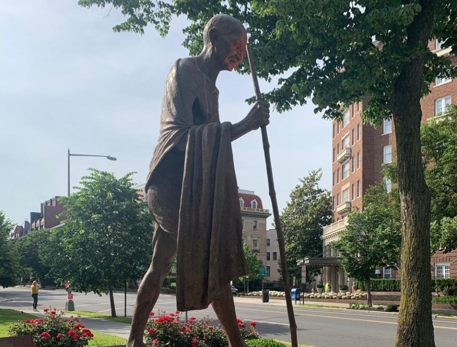 Desecrated Gandhi statue in Washington being cleaned. by .