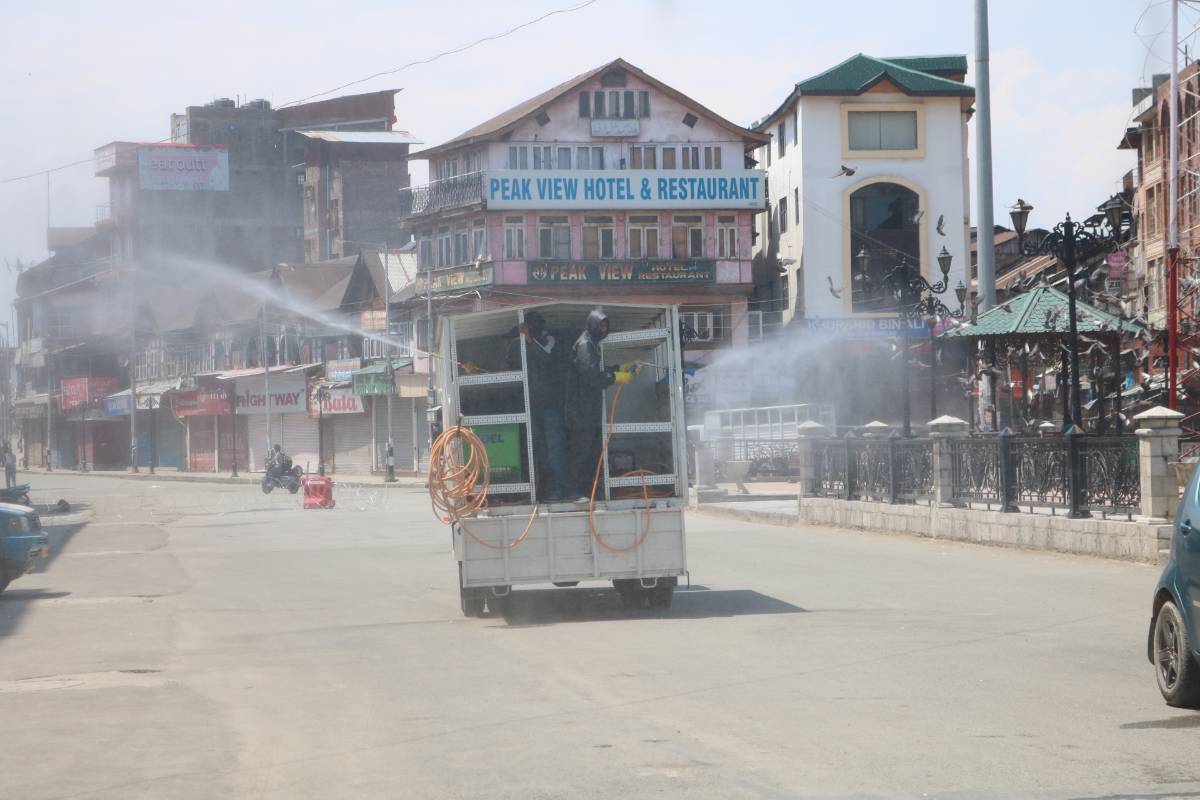 Srinagar: Municipal workers spray disinfectants during a sanitisation drive conducted across Srinagar during the extended nationwide lockdown imposed to mitigate the spread of coronavirus; on Apr 27, 2020. (Photo: IANS) by .