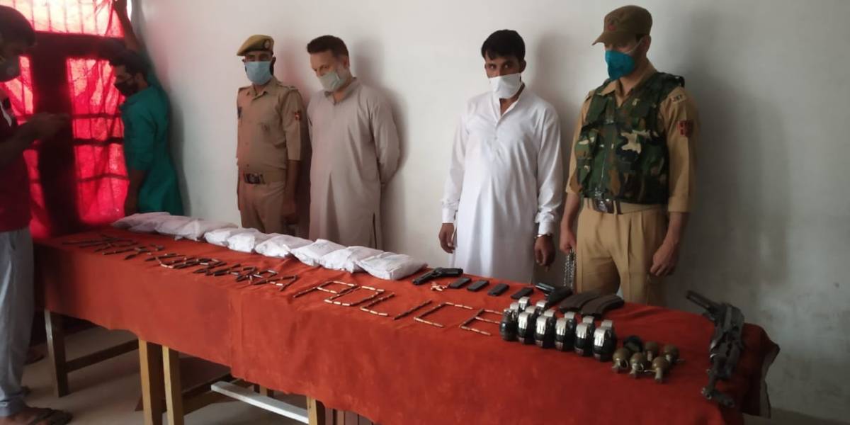 Kupwara: Security forces arrested three persons and seized a consignment of drugs, arms and ammunition in the Kupwara district of North Kashmir on July 26, 2020. A joint team of the army and the police seized 10 kg of brown sugar, 20 grenades, an AK-47 rifle & two pistols, and two vehicles at Sadhna Top in Kupwara. (Photo: IANS) by .