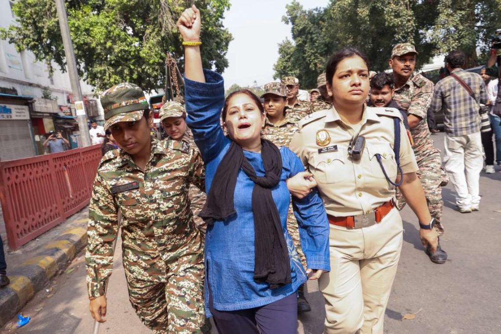 Title : New Delhi: Protest Against Gyanesh Kumar Caption : New Delhi: Security personnel detain a protester during a demonstration against Chief Election Commissioner Gyanesh Kumar at Connaught Place in New Delhi on Saturday, October 10, 2026. (Photo: IANS/Prem Nath Pandey)
