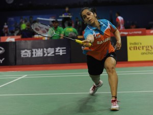 Indian badminton player Saina Nehwal in action against he Indonesian counterpart Lindaweni Fanetri during quarter-final match of Uber Cup at Siri Fort in New Delhi on May 22, 2014. Saina defeated Fanetri by 2-0. (Photo: IANS)