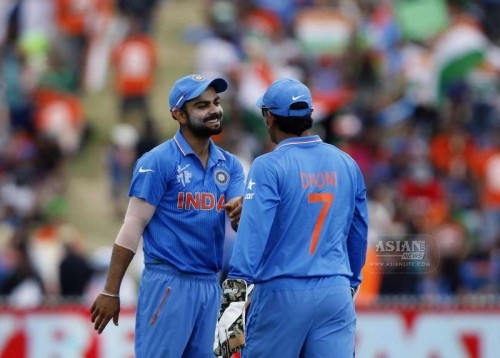 Indian cricketers Virat Kohli and MS Dhoni during an ICC World Cup - 2015 match against Ireland at the Seddon Park in Hamilton, New Zealand on March 10, 2015.