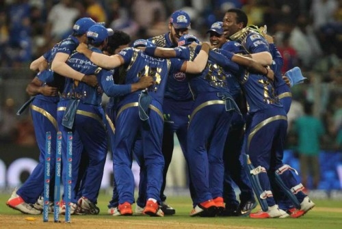  Caption: Mumbai: Mumbai Indians celebrate after wining the first qualifier match of IPL 2015 against Chennai Super Kings at Wankhede Stadium in Mumbai on May 19, 2015