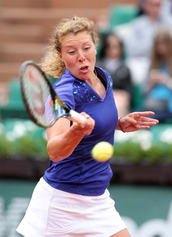 Anna-Lena Friedsam of Germany hits a return during the women's singles second round match against Serena Williams of the United States at 2015 French Open tennis tournament at Roland Garros, in Paris, France on May 28, 2015. Anna-Lena Friedsam lost 1-2