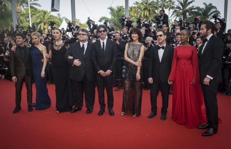 French actress and member of the Feature Film jury Sophie Marceau (4th R) poses with other members of the Feature Film jury on the red carpet as they arrive for the opening ceremony of the 68th Cannes Film Festival in Cannes, France