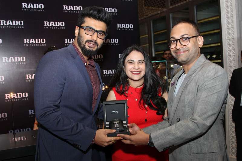 GQ India Editor Che Kurrien presenting a Rado watch to Best-Dressed Man Arjun Kapoor along with Simran Chandok - Brand Manager Rado during GQ Best Dressed Men 2015, at The Four Seasons Hotel in Mumbai