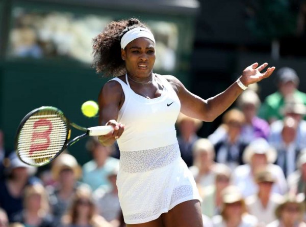  Serena Williams of the United States returns a ball during the women's singles final with Garbine Muguruza of Spain at the 2015 Wimbledon Championships in Wimbledon, southwest London, Britain on July 11, 2015. Serena Williams won 2-0. 