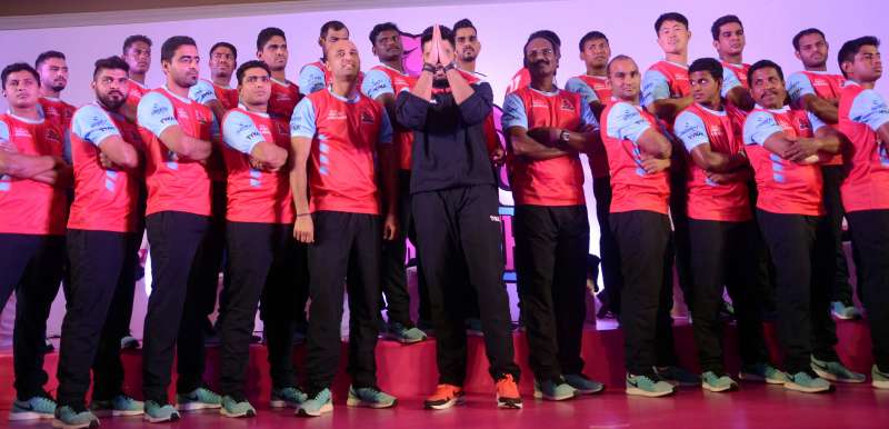 Actor and owner of Pro Kabaddi team `Pink Panther` Abhishek Bachchan with his team during a press conference in Mumbai