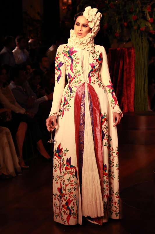 Models walk on the ramp with designer Rohit Bal during the Amazon India Couture Week 2015, in New Delhi.