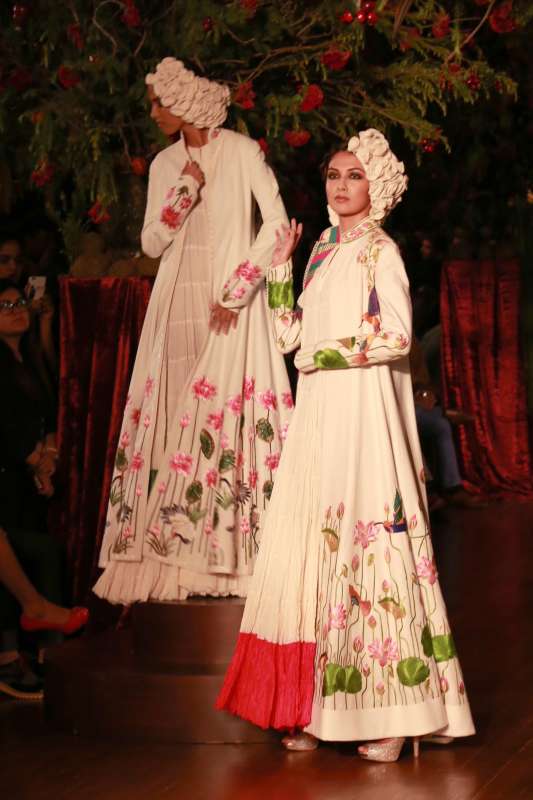 Models walk on the ramp with designer Rohit Bal during the Amazon India Couture Week 2015, in New Delhi.