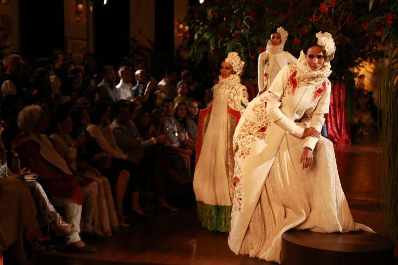 Models walk on the ramp with designer Rohit Bal during the Amazon India Couture Week 2015, in New Delhi.