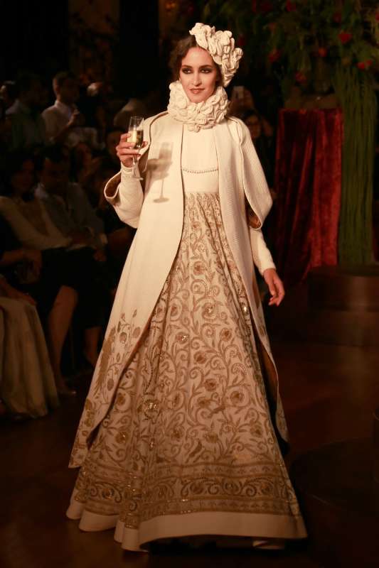 Models walk on the ramp with designer Rohit Bal during the Amazon India Couture Week 2015, in New Delhi.