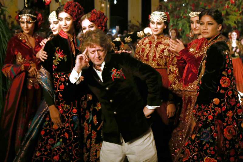 Models walk on the ramp with designer Rohit Bal during the Amazon India Couture Week 2015, in New Delhi.