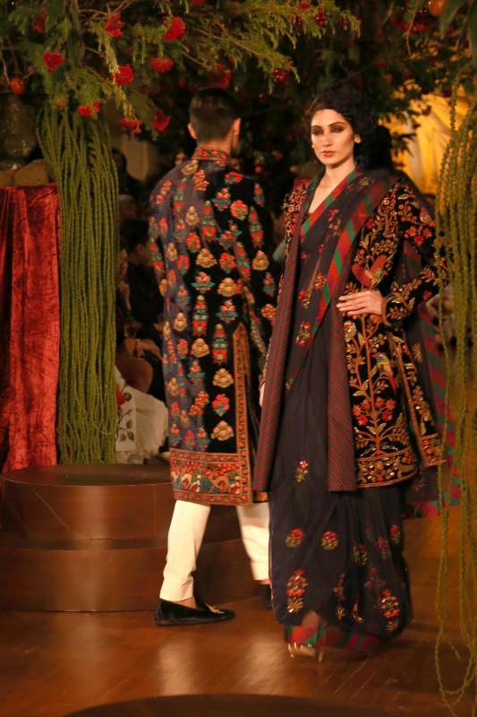 Models walk on the ramp with designer Rohit Bal during the Amazon India Couture Week 2015, in New Delhi.