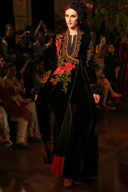 Models walk on the ramp with designer Rohit Bal during the Amazon India Couture Week 2015, in New Delhi.