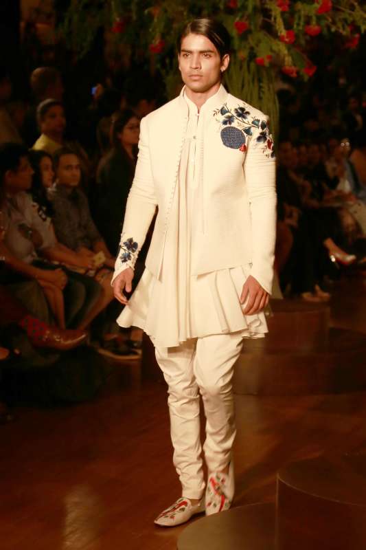 Models walk on the ramp with designer Rohit Bal during the Amazon India Couture Week 2015, in New Delhi.