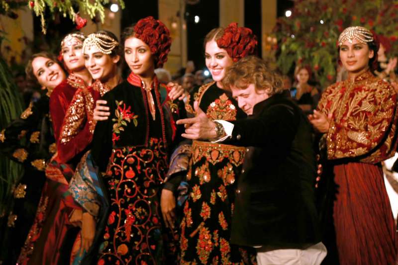 Models walk on the ramp with designer Rohit Bal during the Amazon India Couture Week 2015, in New Delhi.