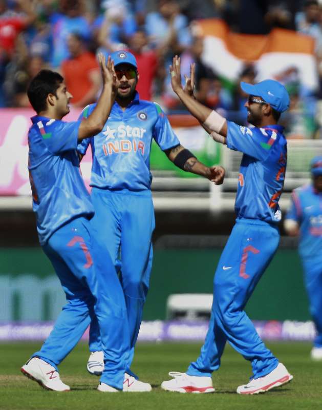 Indian cricketers celebrate fall of Moeen Ali's wicket during a T20 match between India and England at Edgbaston, Birmingham, England on Sept 7, 2014. (Photo: IANS)