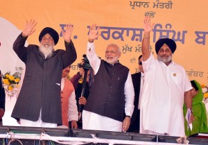 Bathinda: Prime Minister Narendra Modi during the Foundation Stone laying ceremony of All India Institute of Medical Sciences (AIIMS) in Bathinda on Nov 25, 2016. Also seen Punjab Chief Minister Parkash Singh Badal and Sukhbir Singh Badal. (Photo: IANS)