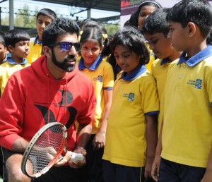 Bengaluru: Indian tennis player Rohan Bopanna interacts with young tennis players during the announcement of the partnership of EduSports and The Rohan Bopanna Tennis Academy at Karnataka State Lawn Tennis Association in Bengaluru on Nov 22, 2016. (Photo: IANS)