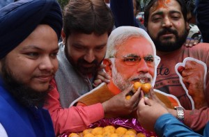 BJP supporters celebrate as assembly election results being announced at BJP office in New Delhi (Photo: IANS)