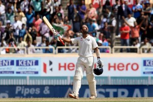 Cheteshwar Pujara of India raises his bat after scoring a century during the third day of the third cricket test match between India and Australia at the Jharkhand State Cricket Association (JSCA) Stadium complex in Ranchi (Photo: Surjeet Yadav/IANS)