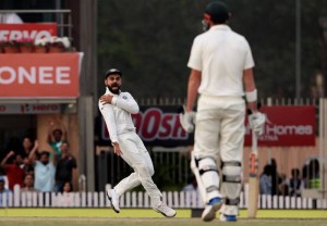 Indian captain Virat Kohli gestures towards Australia's Matt Renshaw as Kohli runs to celebrate the dismissal of David Warner during the fourth day of the third test cricket match in Ranchi (Photo: Surjeet Yadav/IANS)