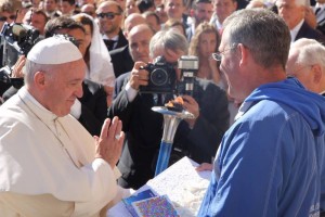 Vatican City: Pope Francis holds the Sri Chinmoy Oneness Home Peace Torch at Vatican City. Also seen former director of Peace Run Salil Wilson. (Photo: IANS)