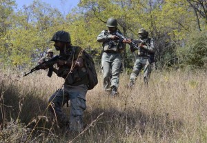 Lachipora: Soldiers in action during an encounter with militants on the Line of Control (LoC) in Lachipora area in Uri sector of Jammu and Kashmir on Sept 21, 2016. (Photo: IANS)