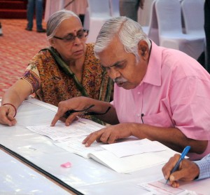 Bengaluru: People filing their Income Tax returns during the inauguration of the 3 day special return receipt counters to facilitate filing of income tax returns of salaried employees and pensioners of Bengaluru city organised by Income Tax Department in Bengaluru, on Aug 29, 2015. (Photo: IANS)