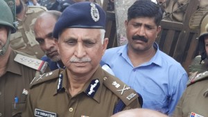 New Delhi: Special Commissioner of Police (Law & Order) SN Shrivastava interact with people at Chand Bagh after the riots in Delhi's North-East, on Feb 27, 2020. (Photo: IANS)