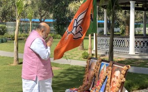 New Delhi: Union Home Minister Amit Shah pays tributes to Bharat Mata, Syama Prasad Mukherjee and Pandit Deendayal Upadhyaya on the 4oth Foundation Day of the BJP, in New Delhi on Apr 6, 2020. (Photo: IANS)