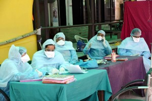 Patna: A team of doctors responsible for screening visitors for COVID-19 wearing Personal Protective Equipment (PPE) suits seen at Nalanda Medical College Hospital in Patna during the 21-day nationwide lockdown (that entered the 18th day) imposed as a precautionary measure to contain the spread of coronavirus, on Apr 11, 2020. (Photo: IANS)