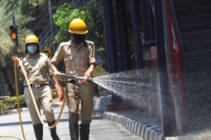 Bengaluru: Fire personnel spray disinfectants at Bengaluru's Chalukya Circle during the nationwide lockdown imposed as a precautionary measure to contain coronavirus, that has now been extended till May 3; on Apr 14, 2020. (Photo: IANS)